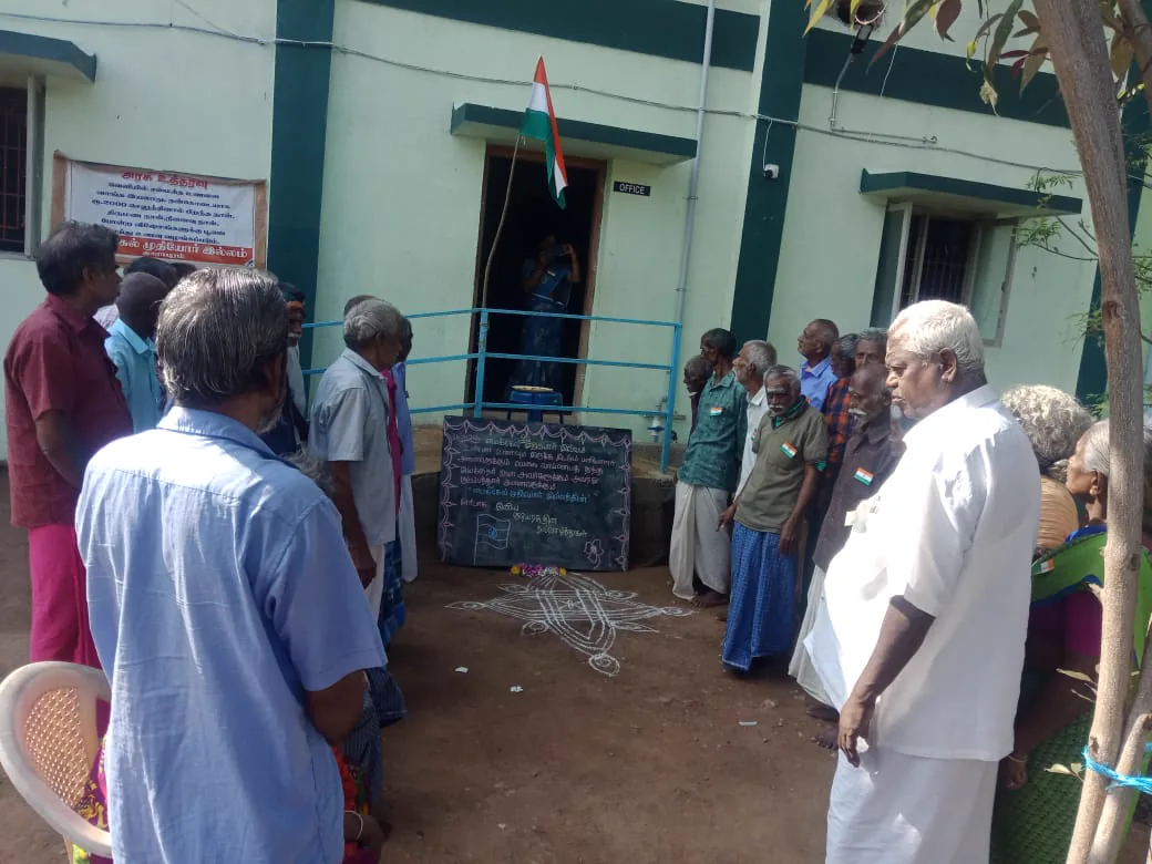 Residents saluting the national flag at a celebration