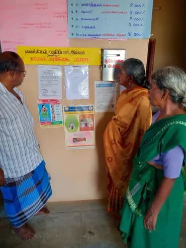 Residents reading health notices at the home